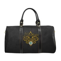 XU Fleur de lis Travel Bag