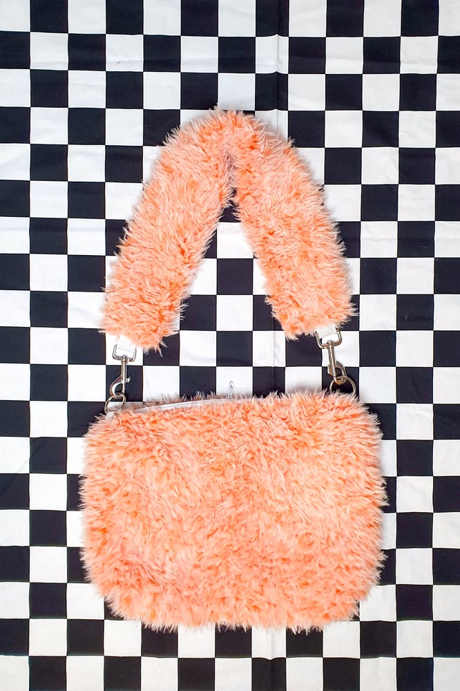 Image of orange fluffy purse
