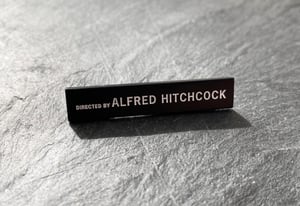 "Directed by Alfred Hitchcock" soft enamel pin