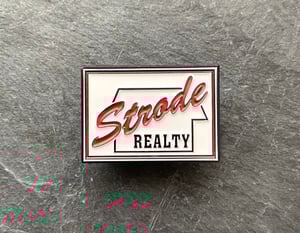 Halloween inspired "Strode Realty" soft enamel pin badge