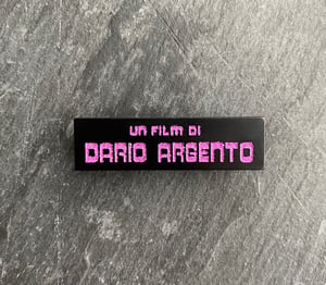 Un Film Di Dario Argento soft enamel pin badge - purple glitter variant