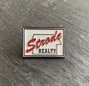 Halloween inspired "Strode Realty" soft enamel pin badge