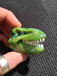 Image 2 of Green energy Tyrannosaurus Rex skull pendant. 