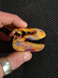 Image 1 of Silver haze Tyrannosaurus rex skull pendant. 