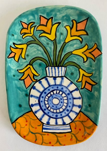 Image of 167 Small Platter with Circle Vase and Lily Flowers