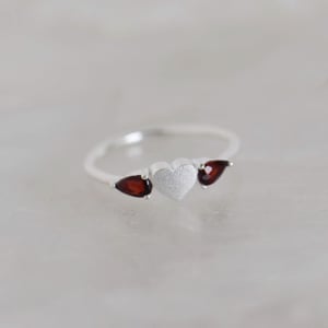 Image of La Petite Garnet Heart pear cut silver ring