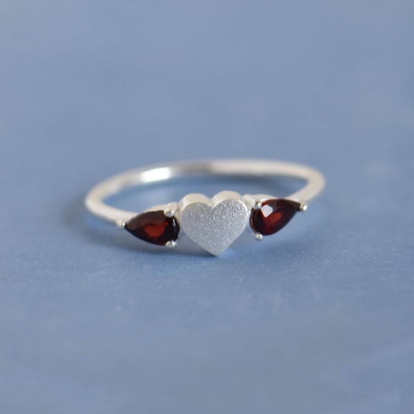 Image of La Petite Garnet Heart pear cut silver ring