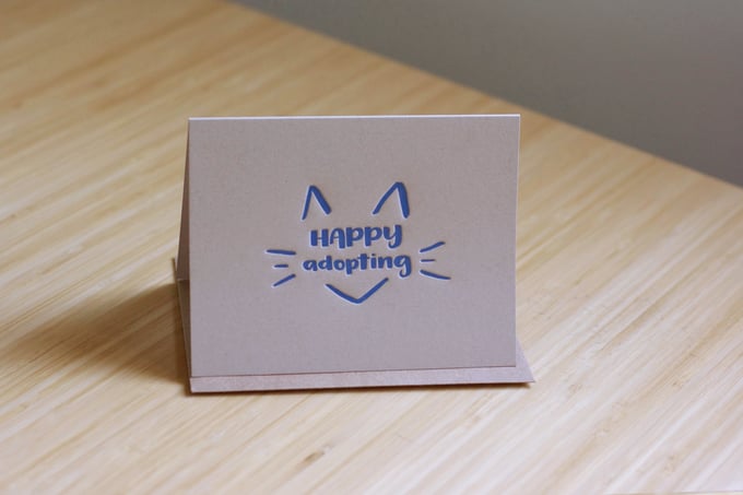 Image of Happy (cat) adopting card