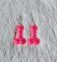 Image 1 of Neon Pink Glitter Penis Earrings