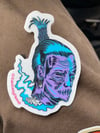 Floating shrunken head sticker 