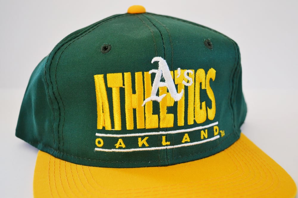 Image of Vintage 1990's Oakland A's Youngan Bar Two-Tone Snapback Hat