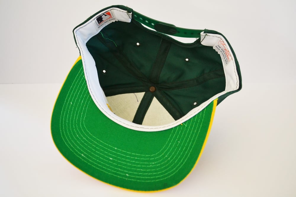 Image of Vintage 1990's Oakland A's Youngan Bar Two-Tone Snapback Hat
