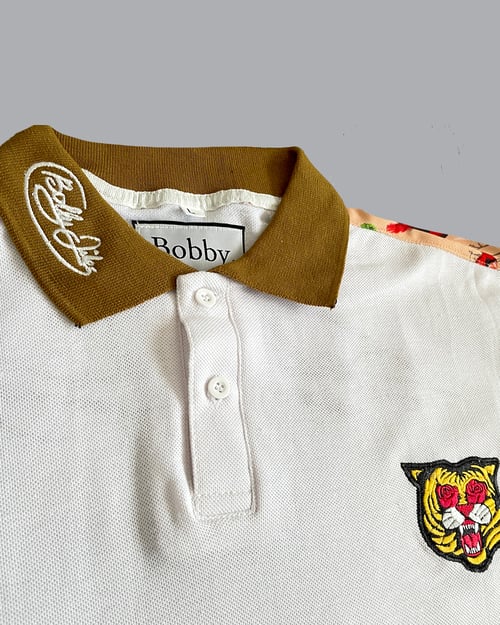Image of The Red Bird Polo in White
