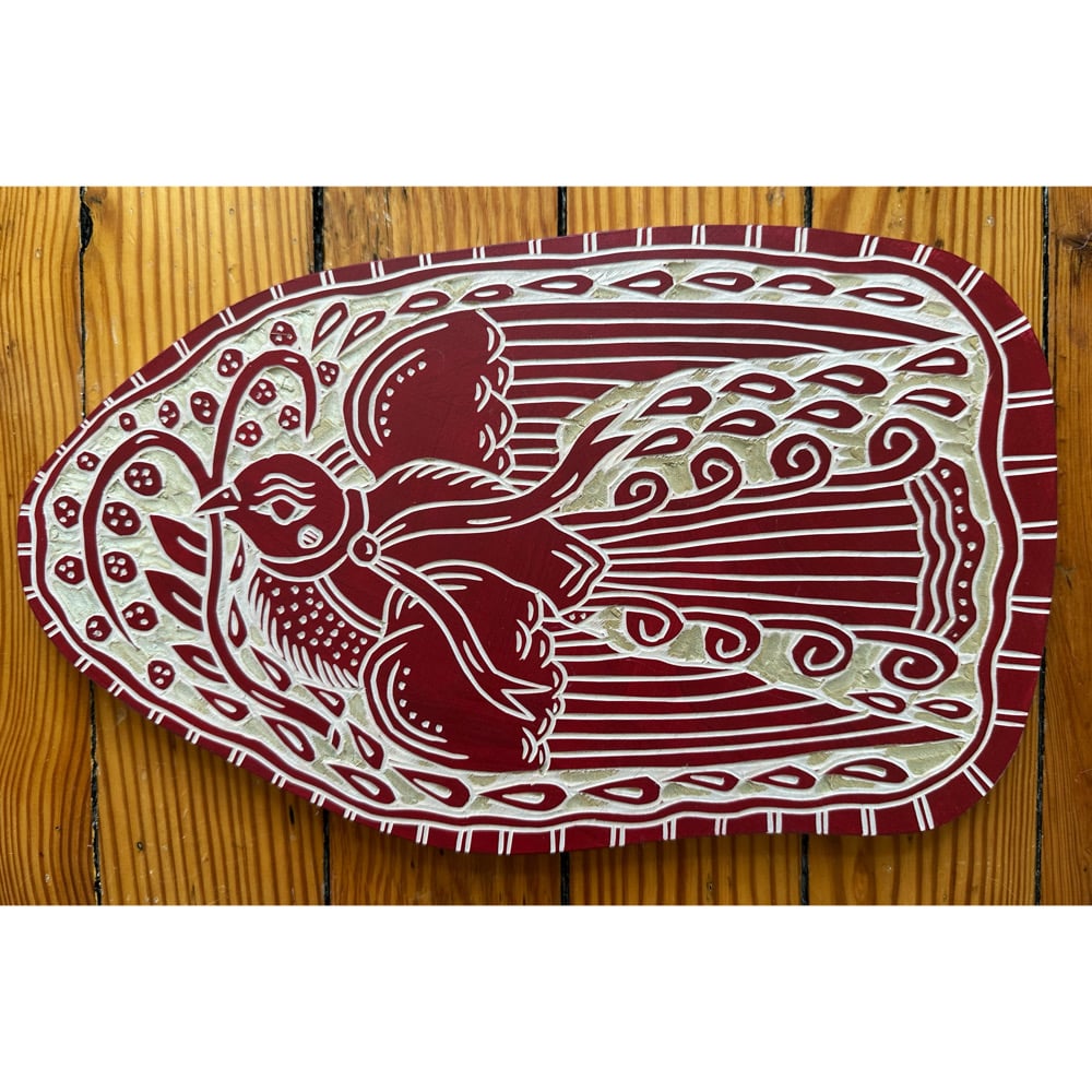 Image of Deep Red Curly Tail Bird