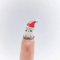 Image 1 of Christmas hat ghost figurine