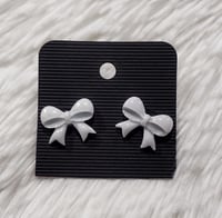 Image 2 of Pearl White Glow Bow Studs