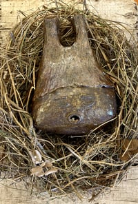 Image 2 of Sleeping Chestnut Baby, 2021, stoneware clay sculpture in handmade nest