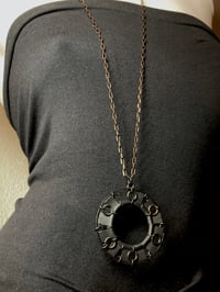 Image 2 of Circle Pendant on Black & Brass Chain