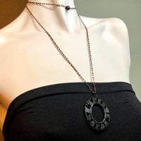 Image 1 of Circle Pendant on Black & Brass Chain