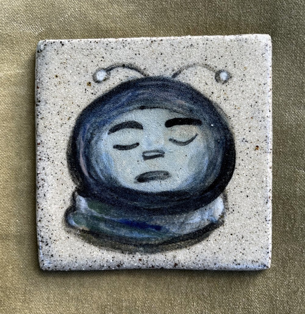 Sleepy Spaceboy, handmade tile with underglaze illustration