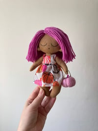 Image 1 of Pink pumpkin doll.