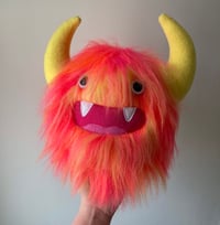 Image 1 of medium pink, orange and yellow horned monster plushie