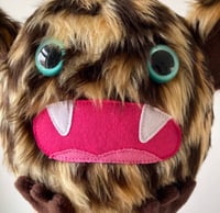 Image 3 of medium leopard print monster plushie