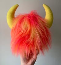 Image 4 of medium pink, orange and yellow horned monster plushie