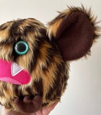 Image 5 of medium leopard print monster plushie