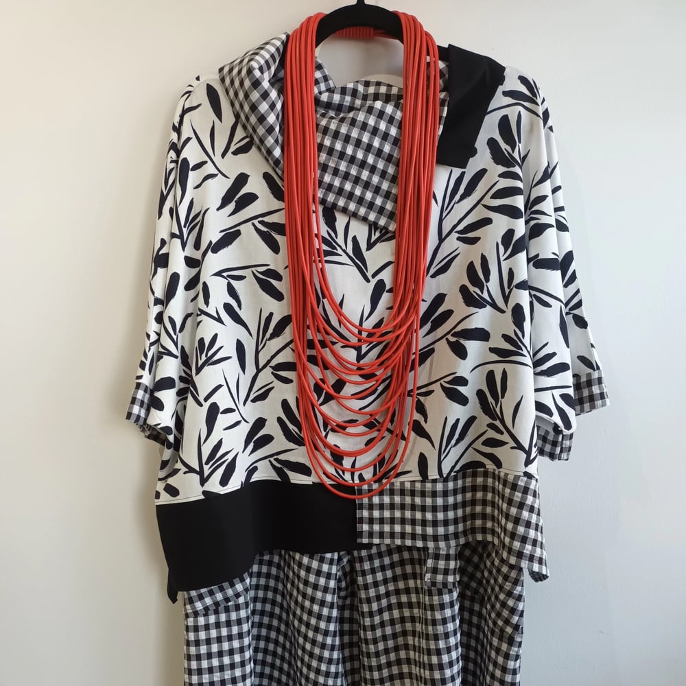 Image of black and white top