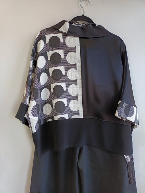 Image of black and white polkadots top