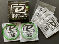 Image 2 of Dunlop Neon Green Monster Energy Plain Steel Electric Guitar Strings Med. 10-46