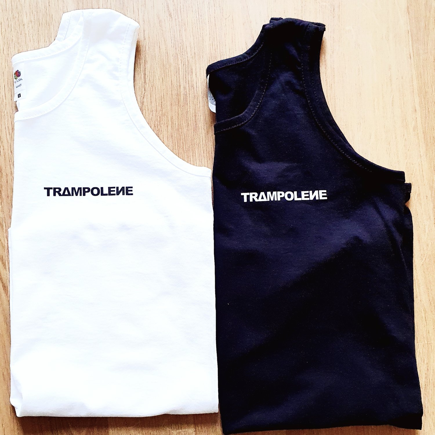 Image of TRAMPOLENE vest in black or white, mens slim fit 'athletic' style