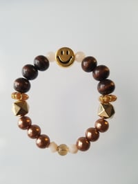 Image 1 of Earth tone smile