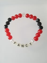 Image 1 of Glow in the dark word Fancy
