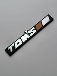 Image 1 of Tom's Plastic Emblem 