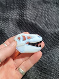 Image 1 of Ghost T-Rex skull pendant.