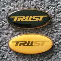 Image 1 of TRUST Gel Token Badges