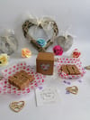 Homemade fudge filled heart windowed box wedding favours