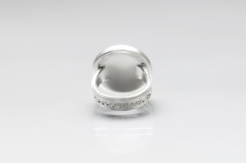 Image of "Every land is.." teddy-bear’s silver ring with photo and rock crystal  · OMNE SOLUM ·