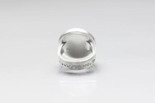 Image of "Every land is.." teddy-bear’s silver ring with photo and rock crystal · OMNE SOLUM ·