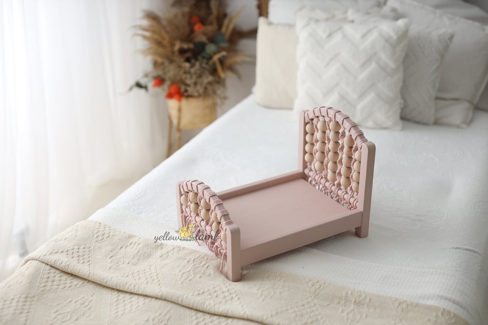 Image of « coral bed NB up to sitter in pink with tow sided mattress, two pillows and headband- pre order »