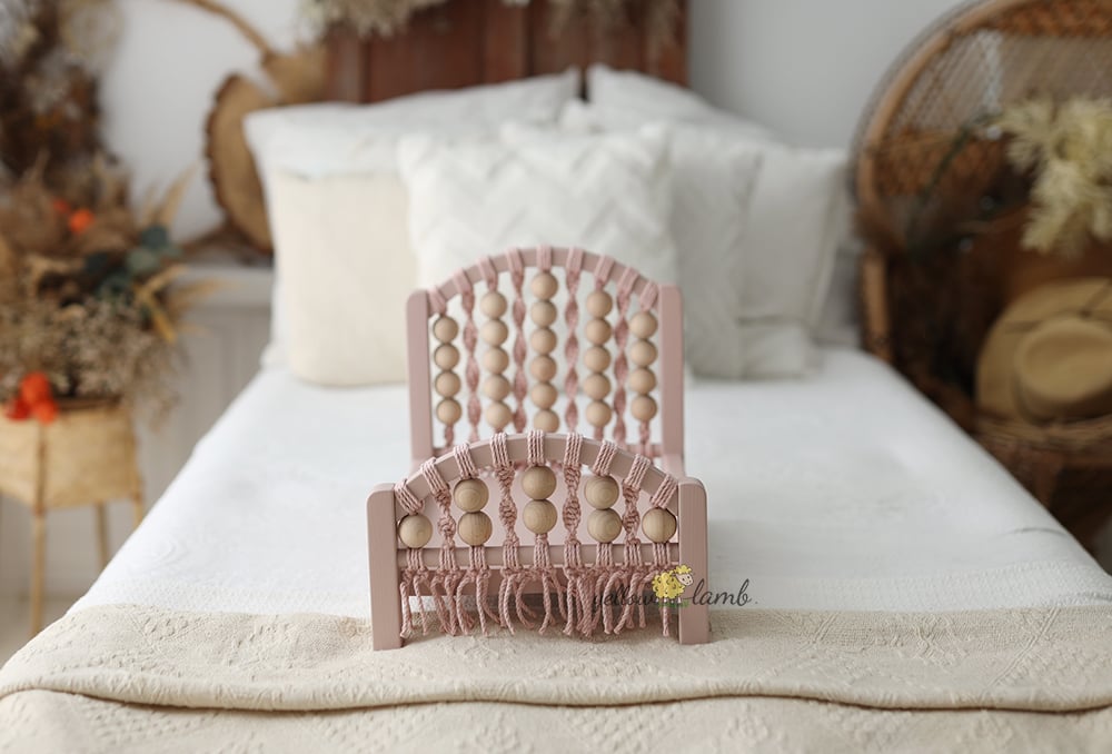 Image of « coral bed NB up to sitter in pink with tow sided mattress, two pillows and headband- pre order »