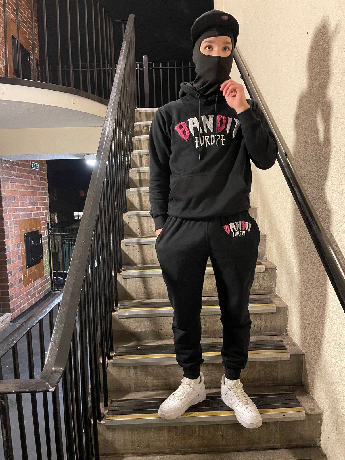 black and pink tracksuit