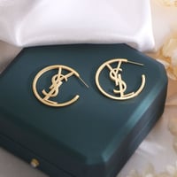 YSL gold earrings.