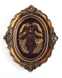 Image 1 of Black Goat in antiqued oval frame
