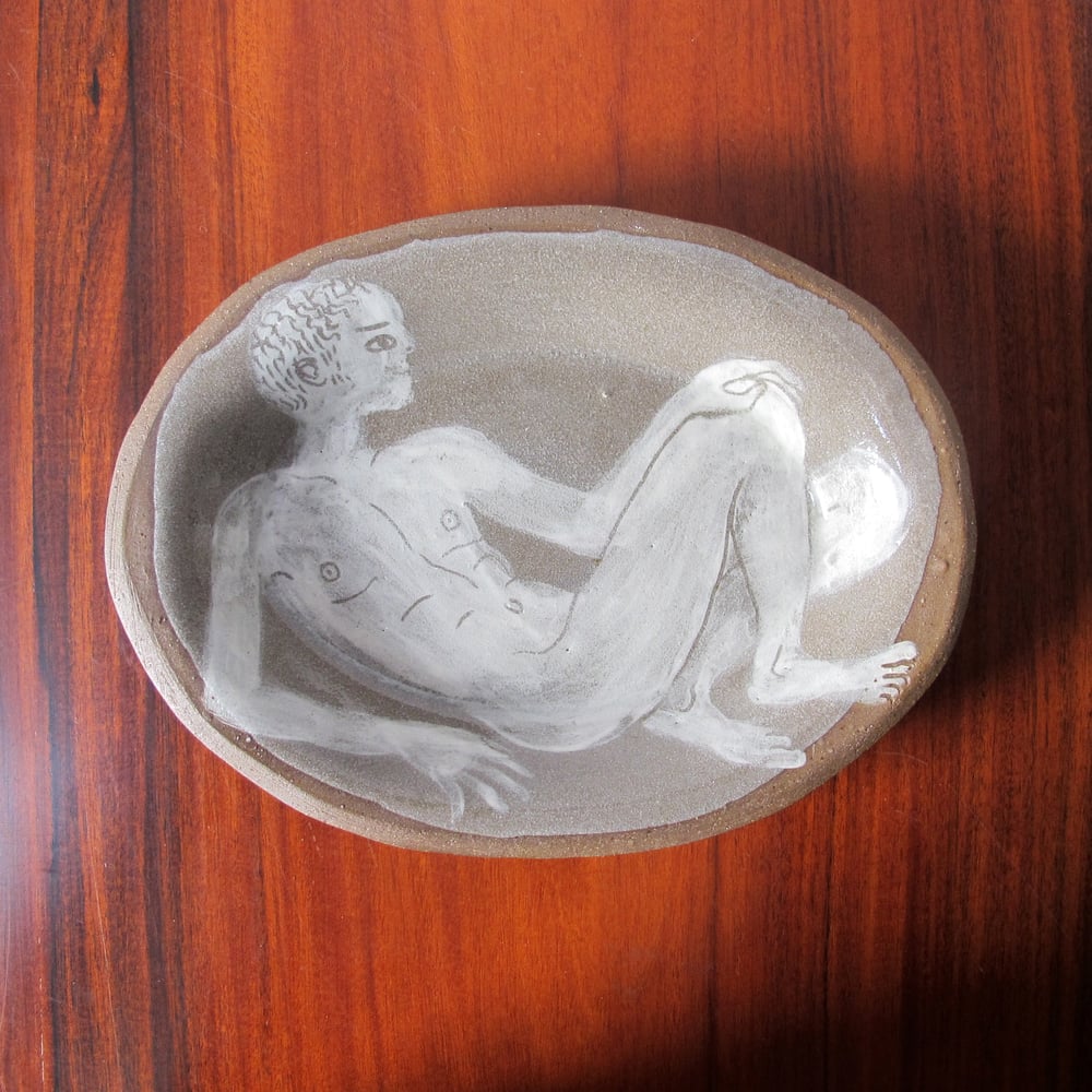 Man in a dish 1