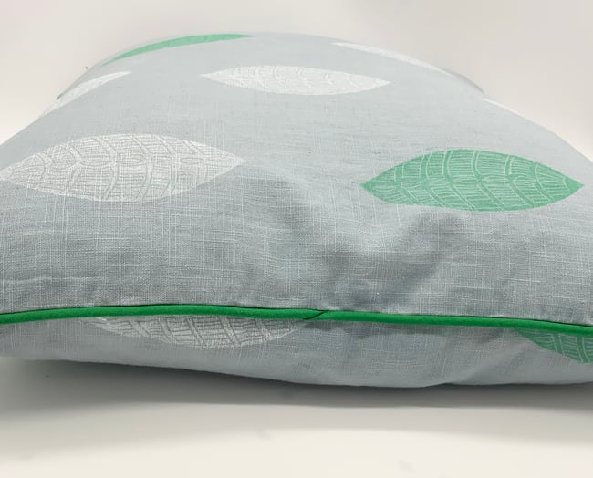 White and green leaf cushion