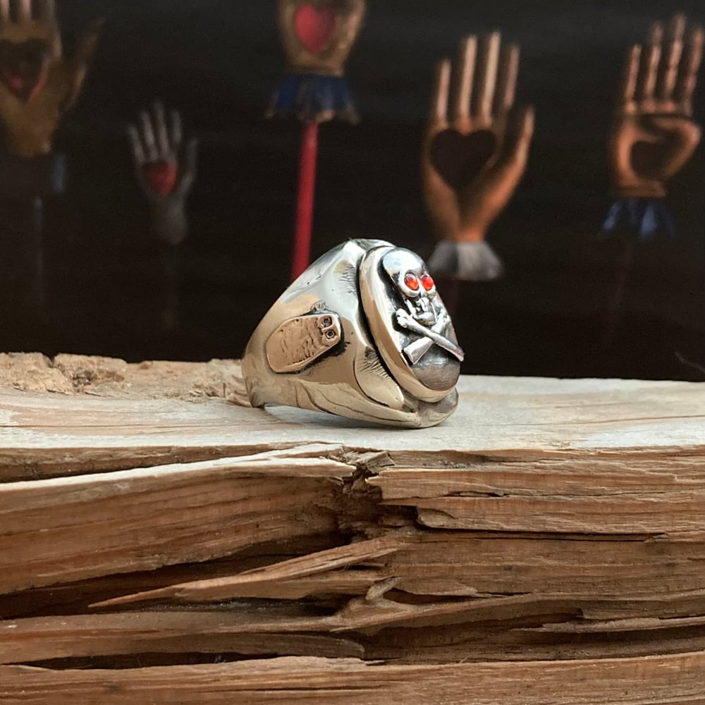 OVAL RUBY EYED SKULL CROSSBONES RING
