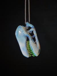 Image 1 of Mirage T-Rex skull pendant with illuminati teeth. 